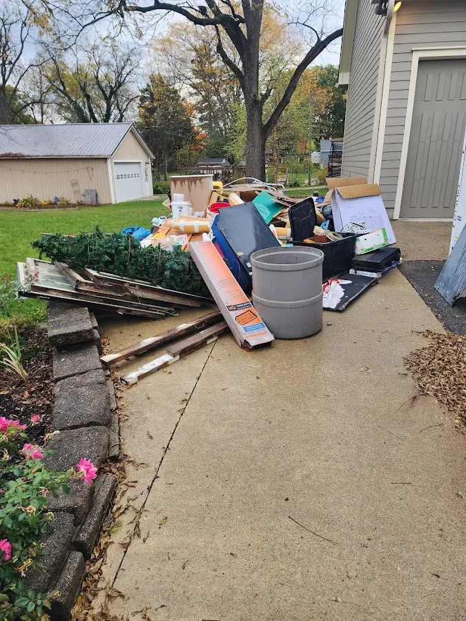 Dumpster being loaded with debris for 12 Yard Dumpster Rental in Lockeford